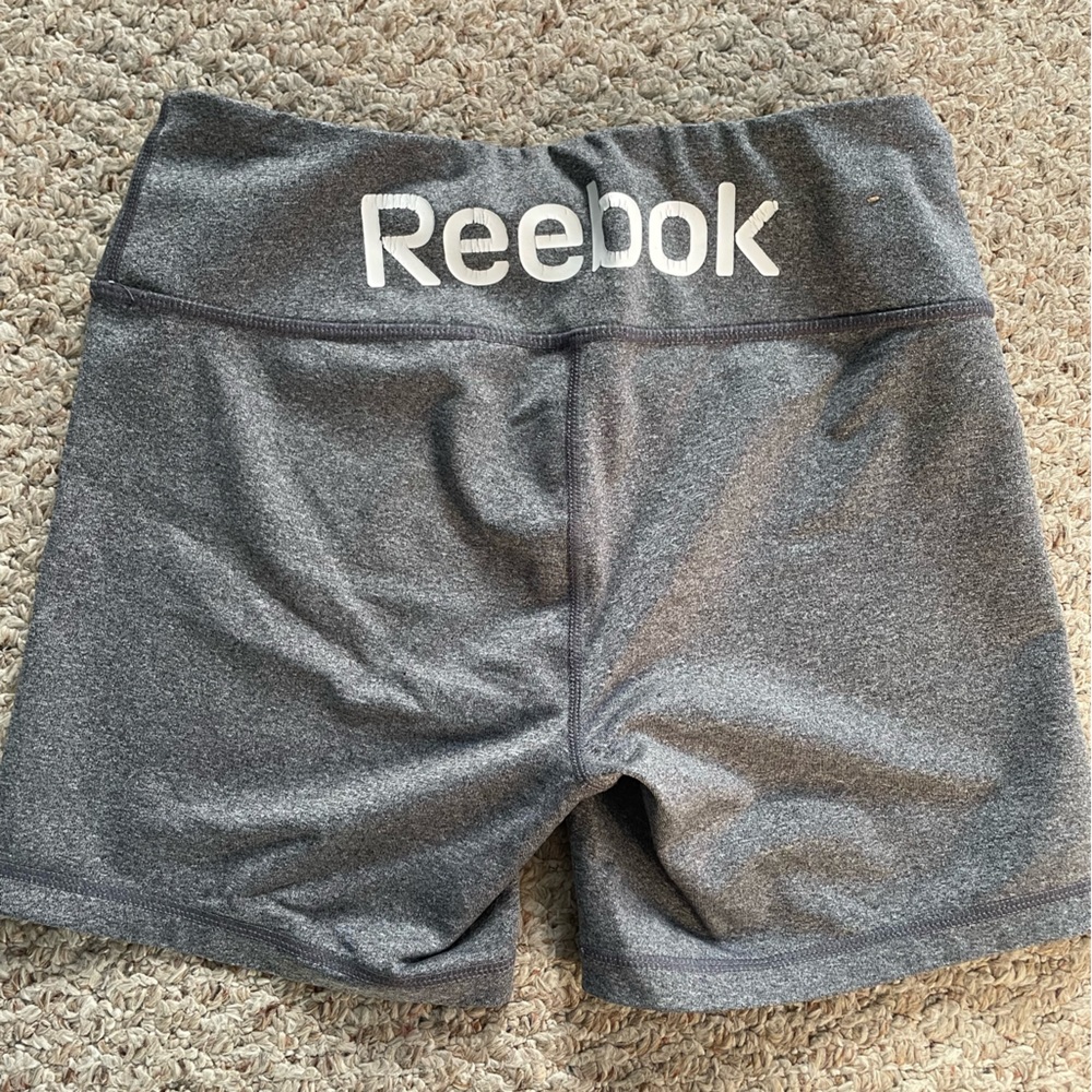 Grey Reebok shorts.